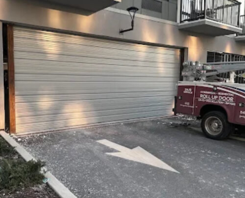 Spring Valley residential rollup garage door technicians install security garage door for a home.