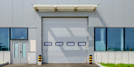 High-speed performance garage doors for parking garage