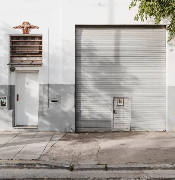 Garage Door Customs commercial steel roll-up door installation service in New York State.